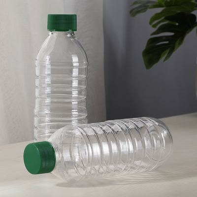 Custom 300ml  Empty Transparent Round Juice PET Plastic Drinking Bottles Spring Water Beverage Container with Lids